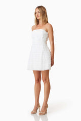 model wearing Hailey Strapless Mini Party Dress In White side shot