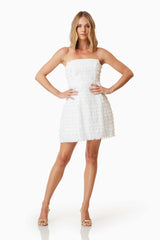 model wearing Hailey Strapless Mini Party Dress In White front shot