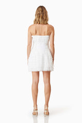 model wearing Hailey Strapless Mini Party Dress In White back shot