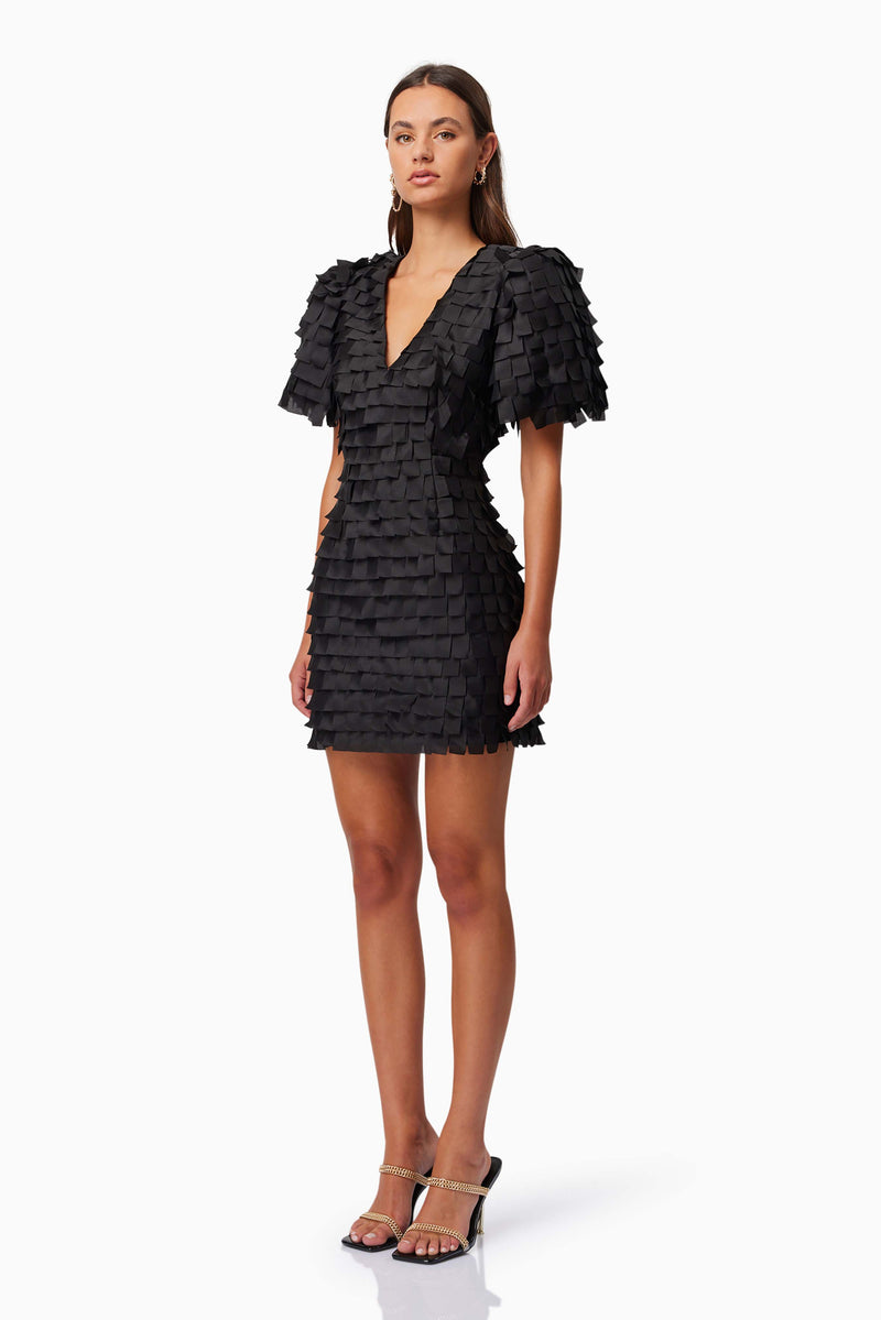 model wearing Hailey Textured 3D Mini Dress In Black side shot