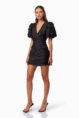 model wearing Hailey Textured 3D Mini Dress In Black side shot