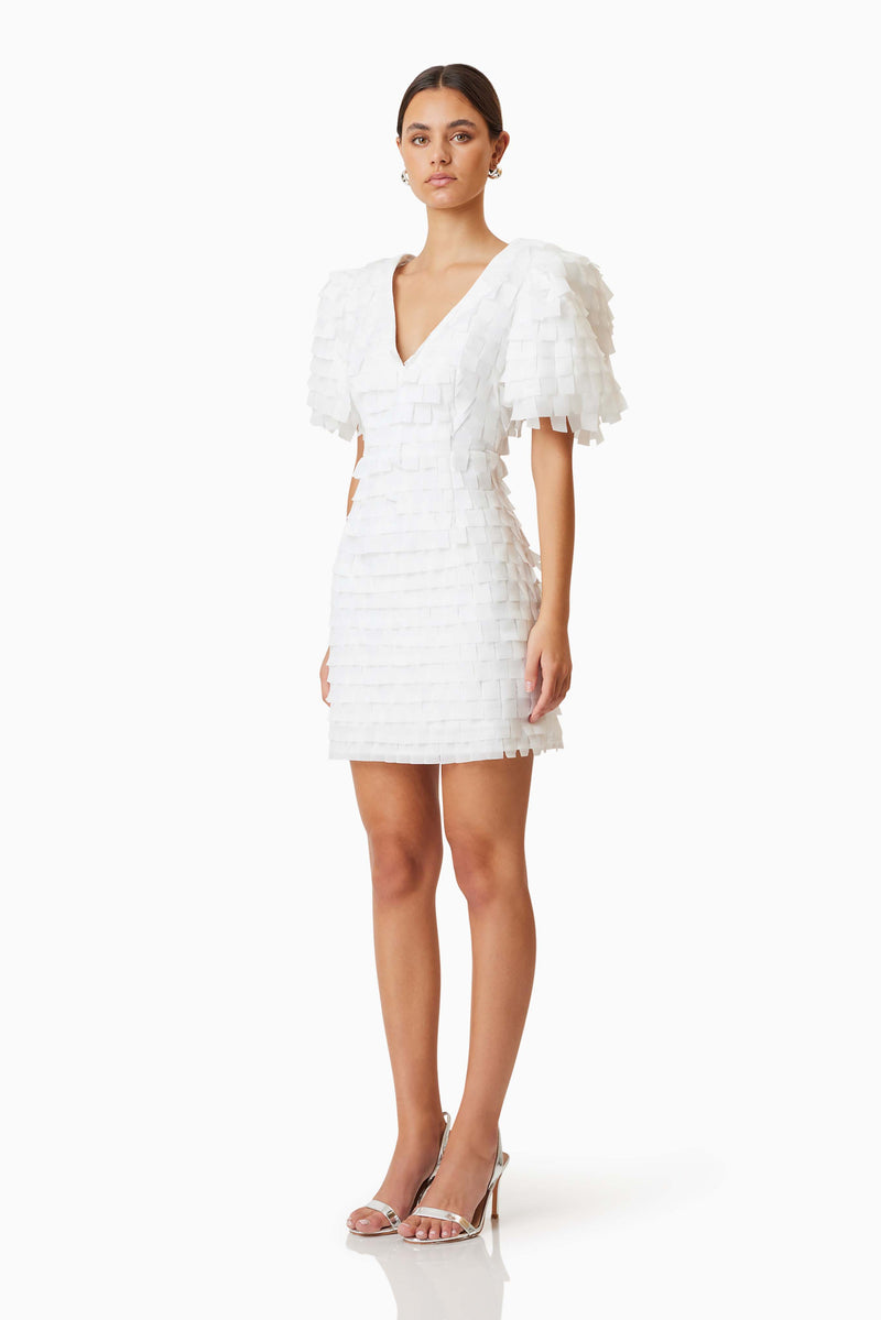 model wearing Hailey Textured 3D Mini Dress In White side shot