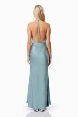 Blonde model wearing Zinnia Backless Satin Maxi Dress In Blue back shot