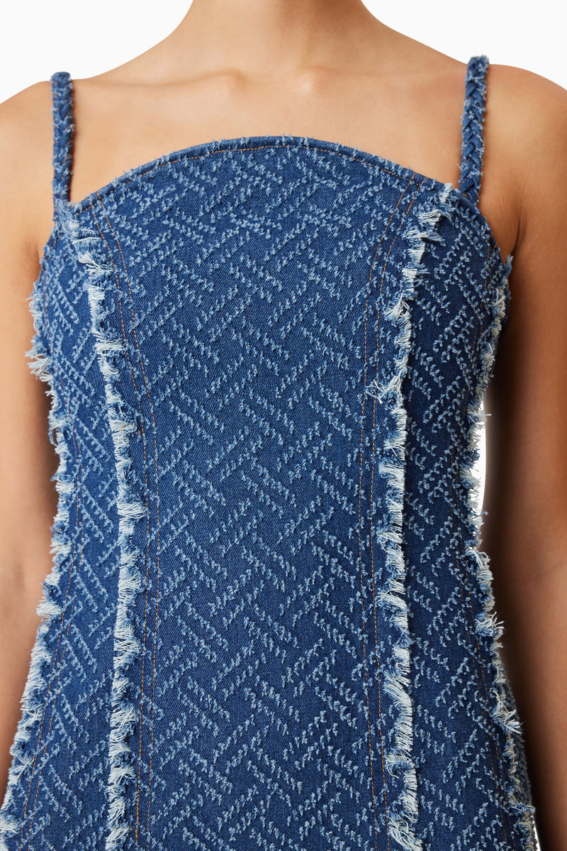 model wearing Cora Denim Mini Dress In Blue close up shot