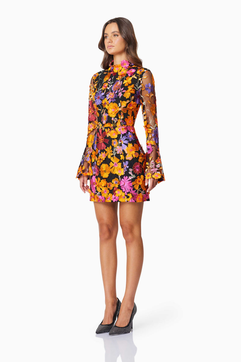 model wearing Alessandra Floral Longsleeve Mini Dress In Orange side shot