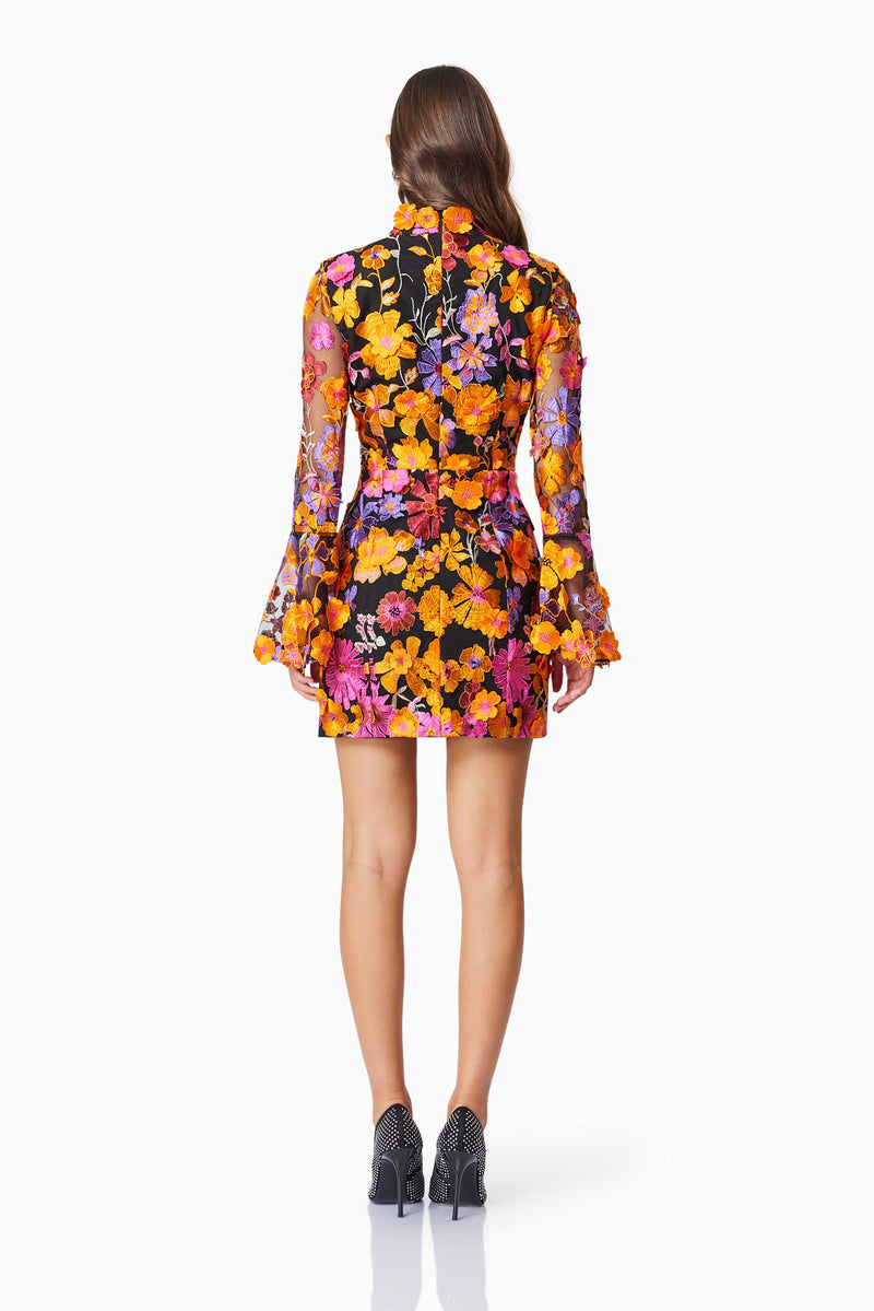 model wearing Alessandra Floral Longsleeve Mini Dress In Orange back shot