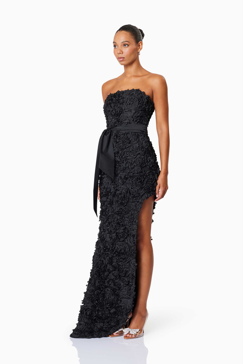 model wearing Megan Strapless Maxi Gown In Black side shot