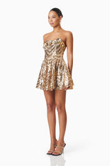 model wearing Alisha Strapless Fit & Flare Mini Dress In Gold side shot