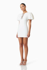 model wearing Delia Diamante Mini Dress In White side shot