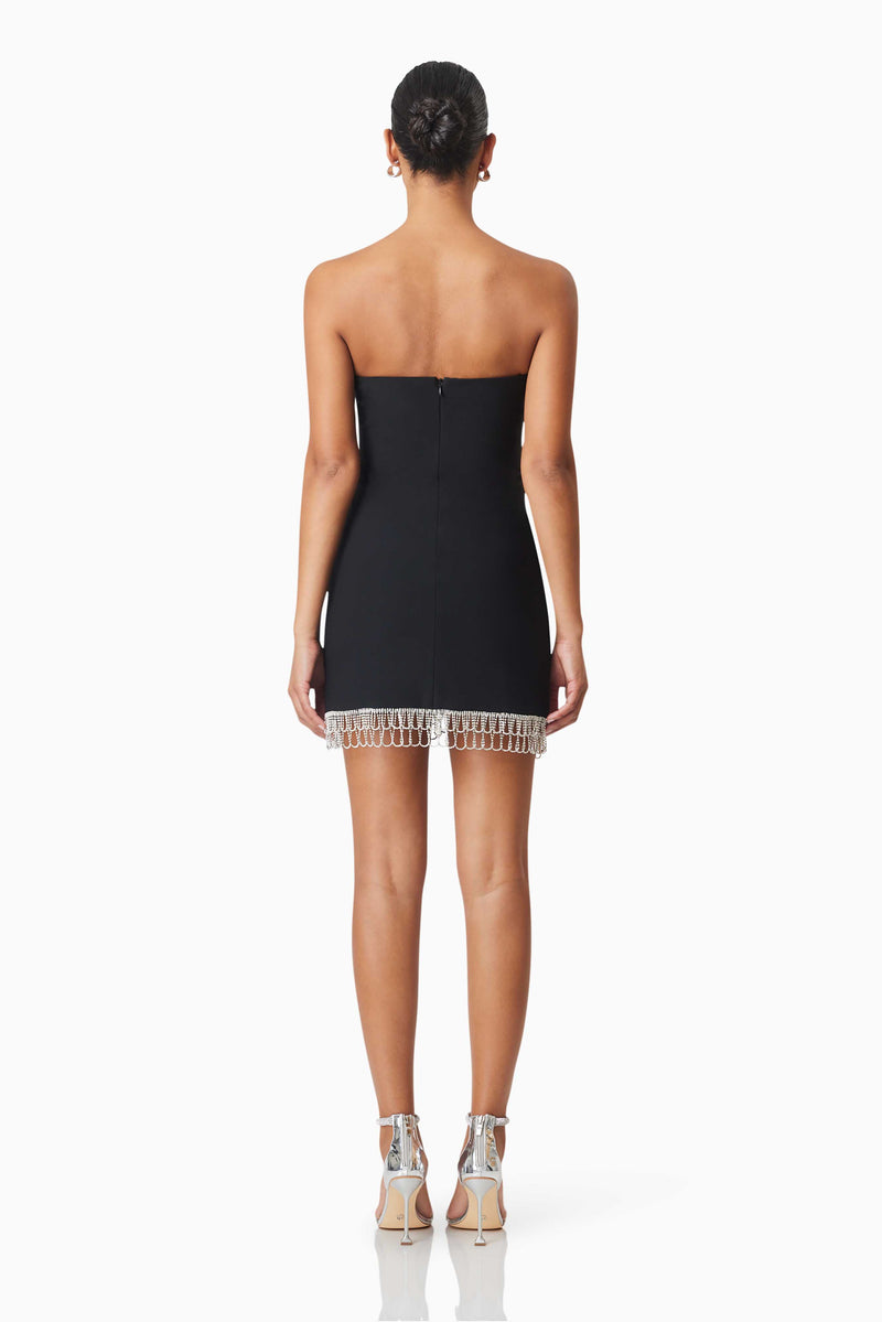 model wearing Delia Party Mini Dress In Black back shot 