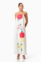 Brunette model wearing Buttercup Embroidered Maxi Dress in White posed shot