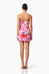 Brunette model wearing Darra Mini Frill Dress in Floral back shot