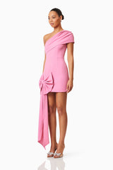 Brunette model wearing Jamie One Shoulder Mini Bow Dress In Pink side shot