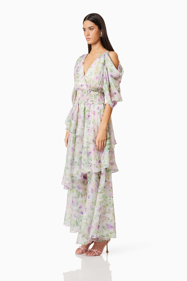 Brunette model wearing Mirabelle Draped Sleeve Maxi Dress In Floral side shot