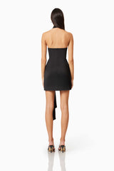 Brunette model wearing Myra Mini Halter Dress in Black back shot