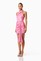 Brunette model wearing Myra Mini Halter Dress in Pink side shot