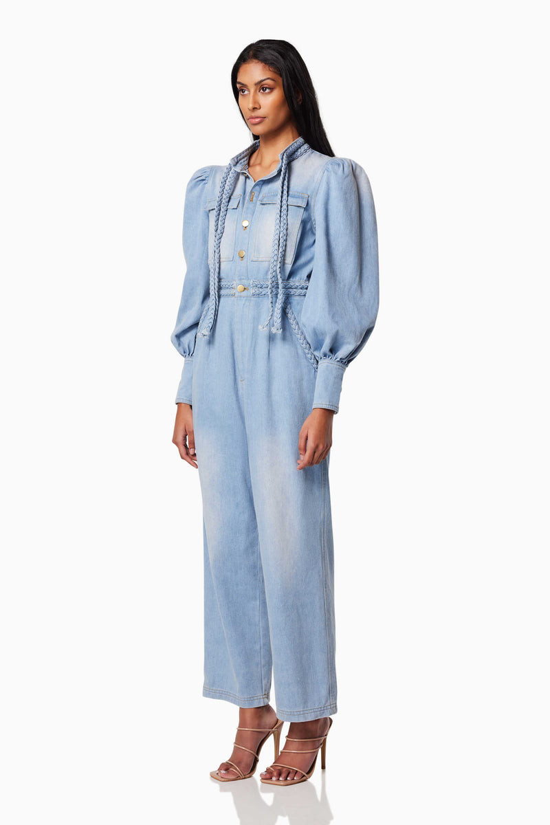 model wearing COUNTRY LONG SLEEVED JUMPSUIT IN BLUE side shot