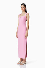 Brunette model wearing Gia Fitted Gown in Pink side shot 