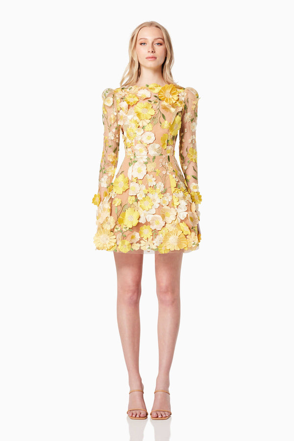 model wearing GOLDENVOICE 3D FLORAL MINI DRESS IN YELLOW front shot