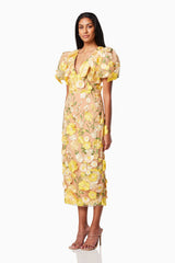 model wearing INDIE 3D FLORAL MIDI DRESS IN YELLOW side shot