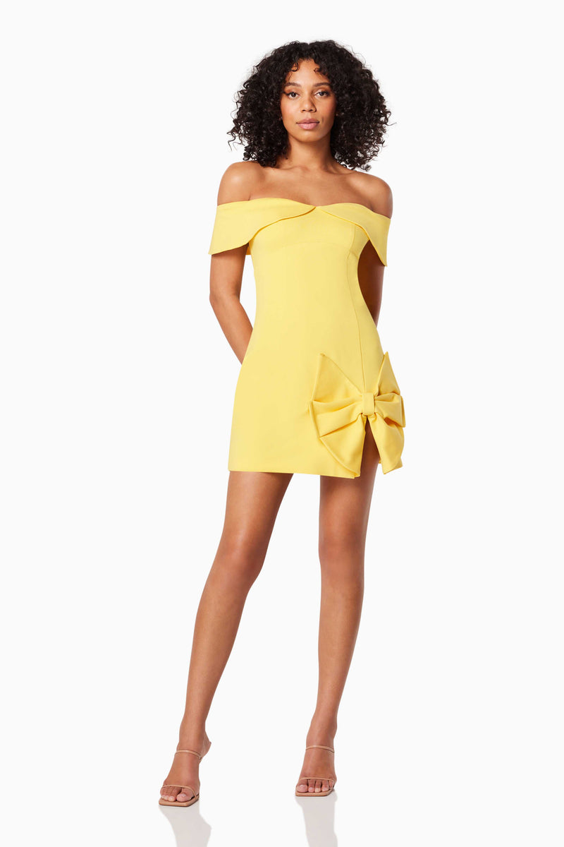 model wears CADENCE OFF THE SHOULDER MINI DRESS IN YELLOW front shot