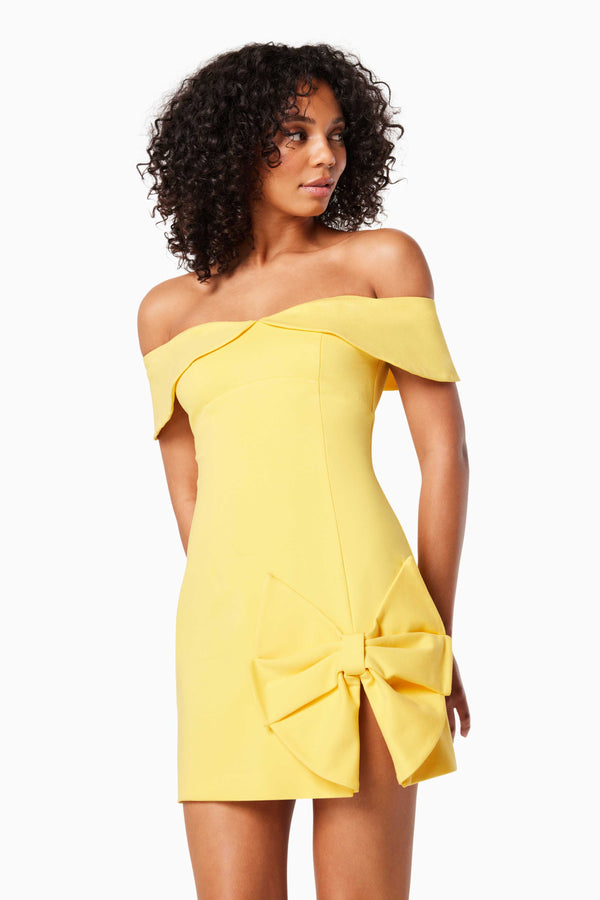 model wears CADENCE OFF THE SHOULDER MINI DRESS IN YELLOW close up shot