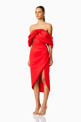 Brunette model wearing MARCH OFF THE SHOULDER MIDI DRESS IN RED side shot