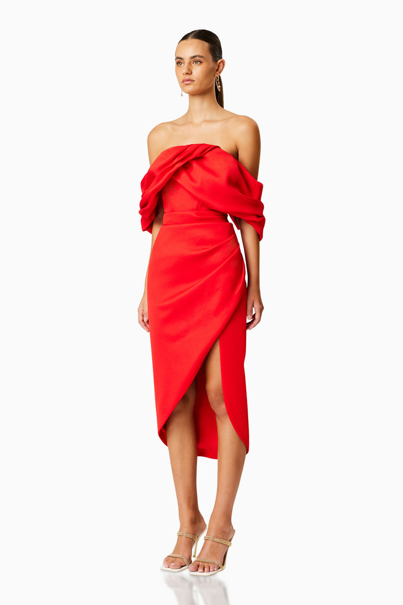 Brunette model wearing MARCH OFF THE SHOULDER MIDI DRESS IN RED side shot