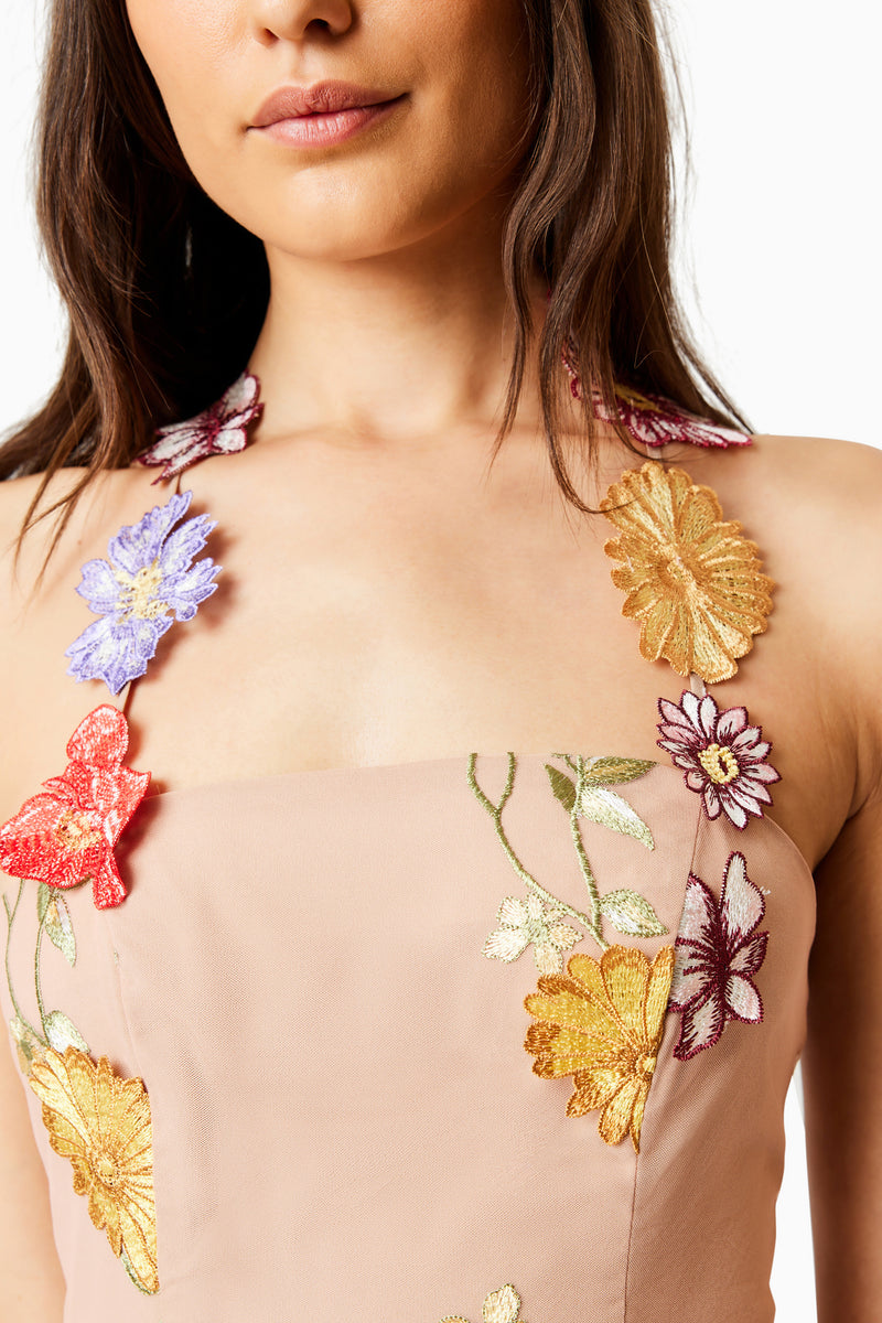 Brunette model wearing LARK FLORAL MIDI DRESS in MULTI close up shot