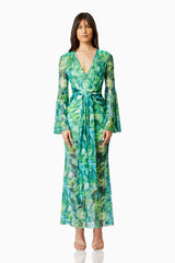 Brunette model wearing JONQUIL LONG SLEEVE MAXI DRESS IN GREEN front shot