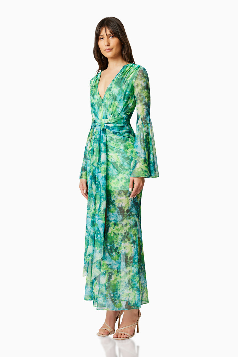 Brunette model wearing JONQUIL LONG SLEEVE MAXI DRESS IN GREEN side shot