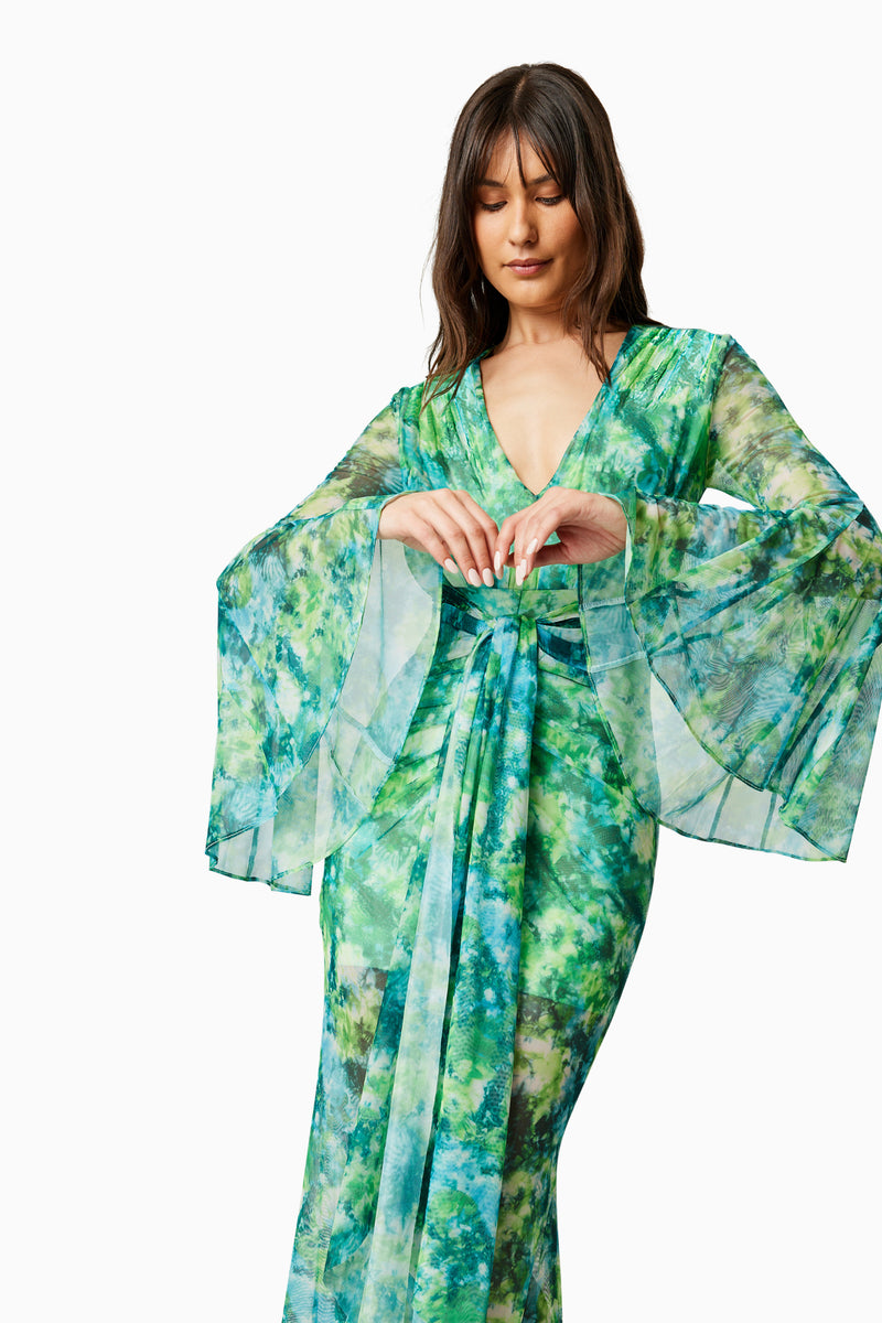 Brunette model wearing JONQUIL LONG SLEEVE MAXI DRESS IN GREEN close up shot