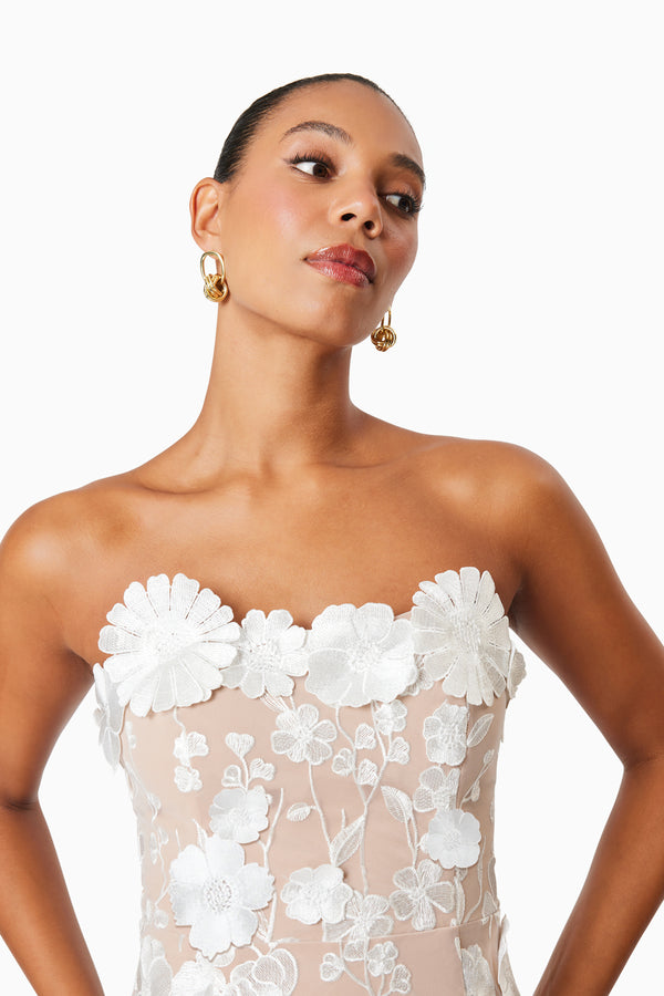model wearing Arabella floral mini dress in ivory close up shot