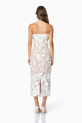model wearing Helena floral midi dress in white back shot