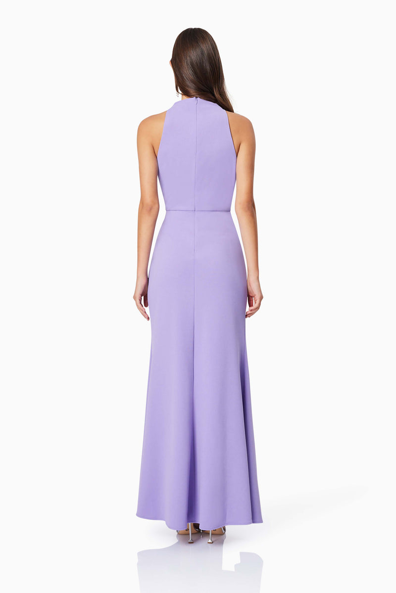 BROWN HAIR MODEL WEARING JADE HIGH NECKLINE FITTED MAXI DRESS IN LAVENDER BACK SHOT