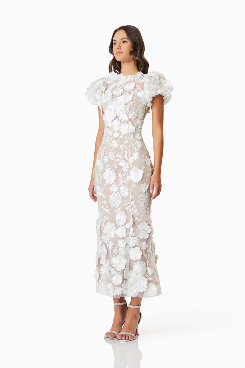model wearing Astraea 3D Lace Maxi Dress In White side shot