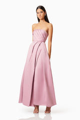 Brunette model wearing Rose Strapless Gown In Blush side shot