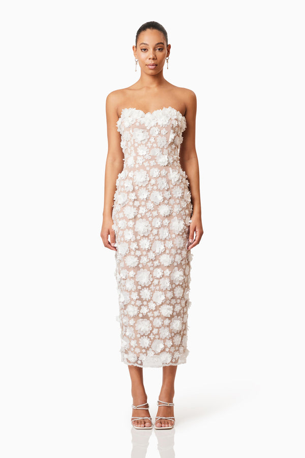 Brunette model wearing Bluebell 3D Midi Dress in White front shot 