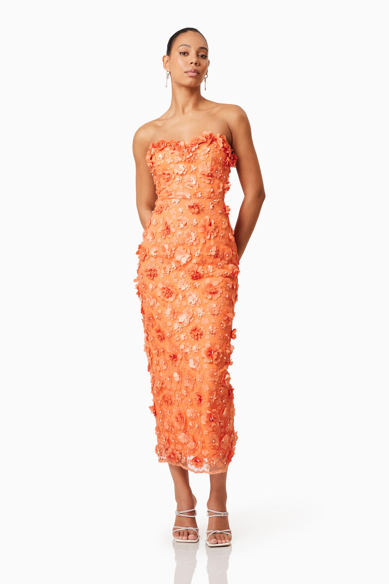 Brunette model wearing Bluebell 3D Midi Dress in Orange posed shot