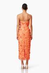 Brunette model wearing Bluebell 3D Midi Dress in Orange back shot