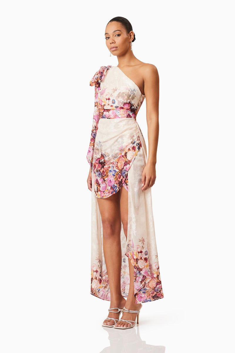 Brunette model wearing Perla Hilo One Shoulder Gown in Floral side shot