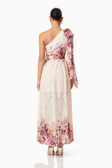 Brunette model wearing Perla Hilo One Shoulder Gown in Floral back shot