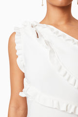 Brunette model wearing Kimberley Frill Mini Dress in White detail shot