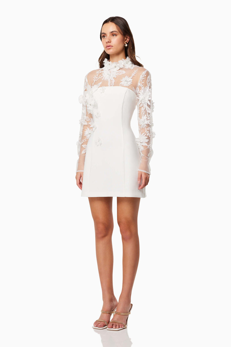 model wearing Elliatt DAMARIS 3D BEADE MESH MINI DRESS IN WHITE side shot