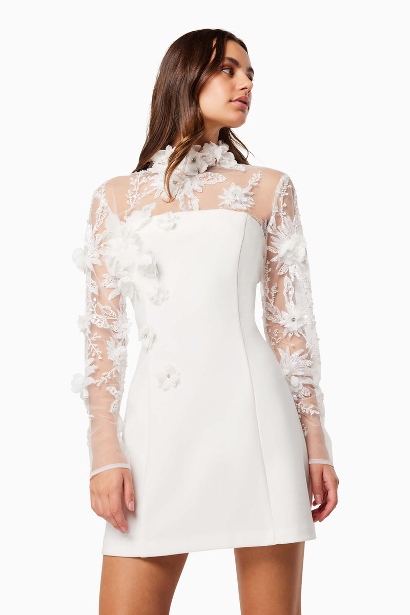 model wearing Elliatt DAMARIS 3D BEADE MESH MINI DRESS IN WHITE close up shot