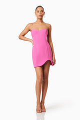 Brunette model wearing Janelle Strapless Mini Dress In Pink posed shot