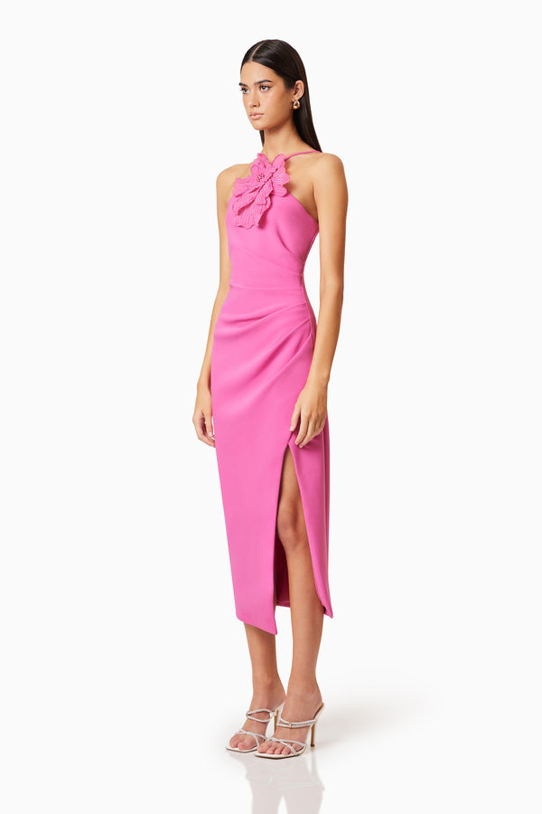 Brunette model wearing Janelle 3D Midi Dress In Pink side shot