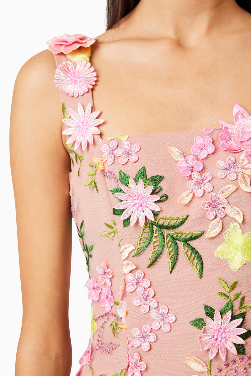 Brunette model wearing Aella Embroidered Mini Dress In Pink detail shot