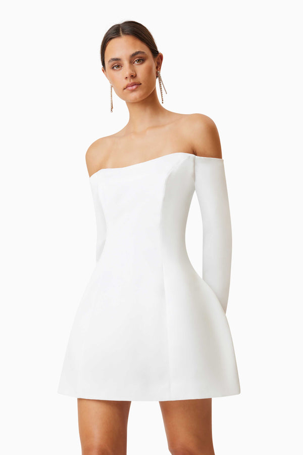 model wearing Vida Off The Shoulder Day Mini Dress In White close up shot