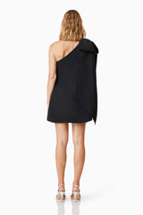 Blonde Model Wearing Kennedy Party Dress In Black Back Shot